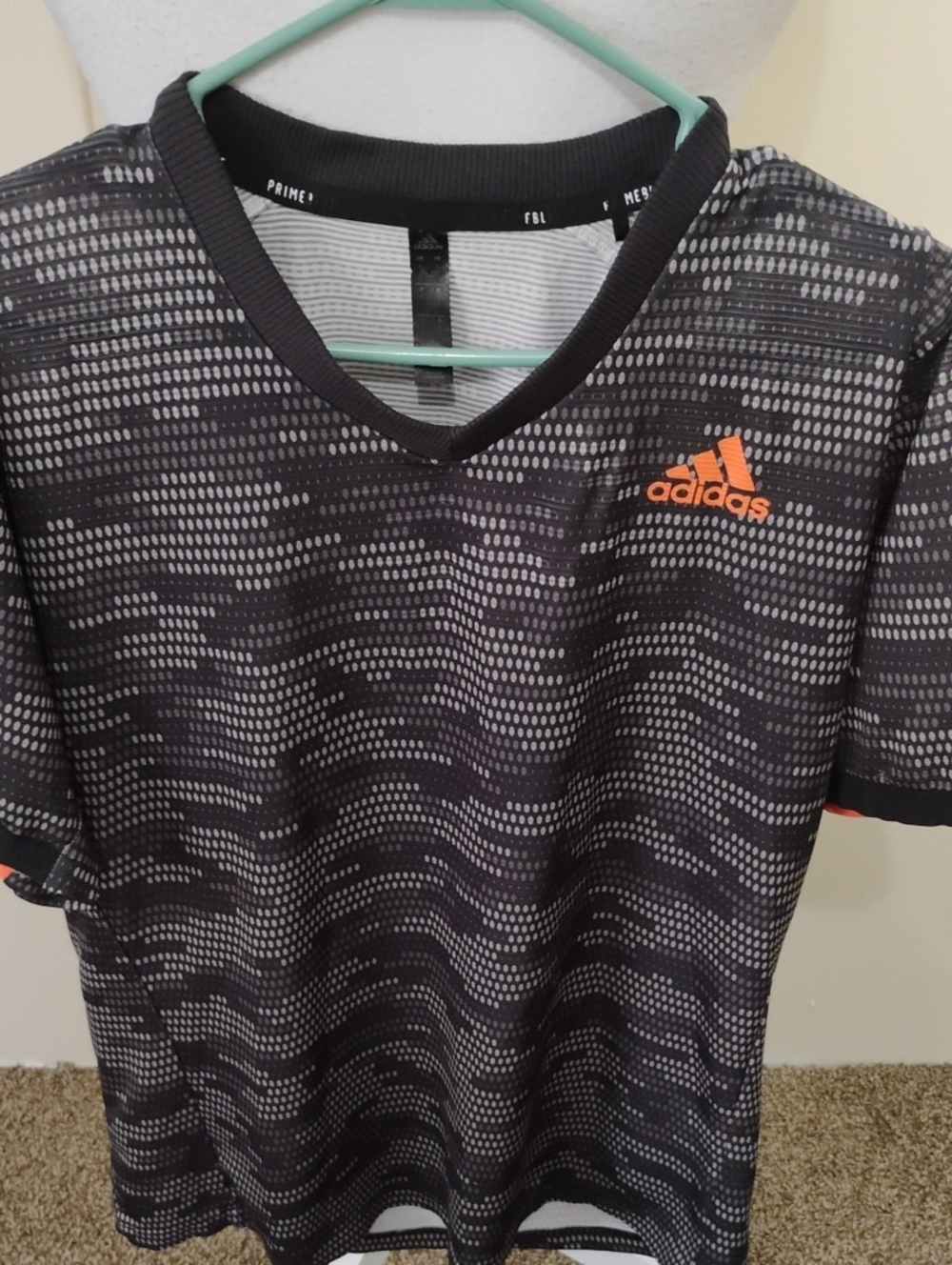 adidas Prime Men’s Black and Gray Patterned Training Tee with Orange Logo